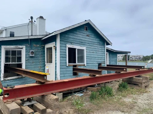A coastal home raised on steel beams during a FEMA house elevation