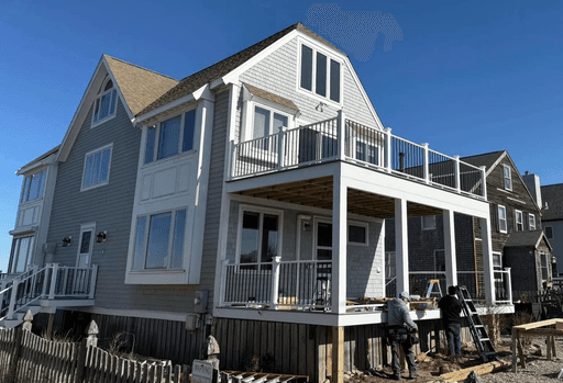 A multi-level deck and railing on a coastal Biviano home